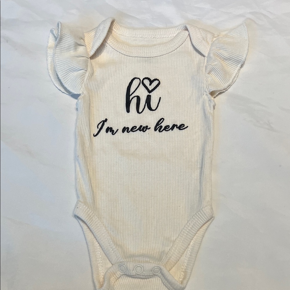“Bundle 10/$13” Kidgets 6-9M Cream Baby bodysuit with Heart Design